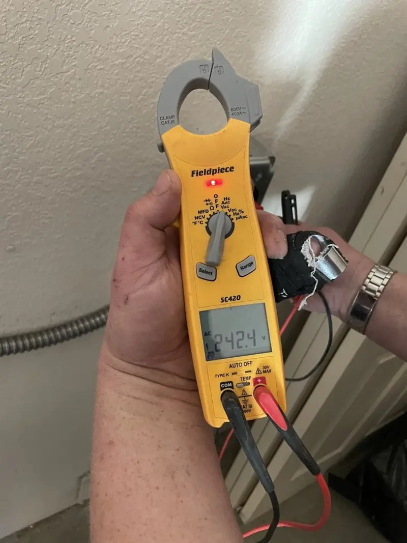 Voltage testing with clamp meter during Electrical Installation Services in Headland